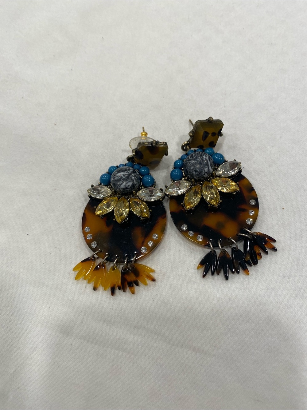 Tortoise shell statement earrings with blue beads and rhinestones.